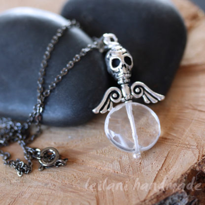 crystal quartz faceted coin with skull and wings pendant