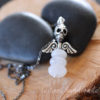 faceted moonstone skull and wings pendant