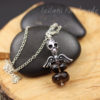 skull and wings pendant featuring smokey quartz gemstone