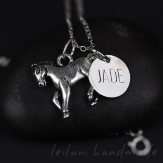 silver horse necklace personalized with a disk that says JADE