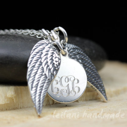 pair of sterling silver wings with monogram charm necklace