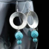 faceted turquoise dangle earrings with textured metal focal