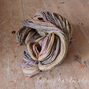 lodestone 2ply merino yarn with greyscale soft oranges and yellows
