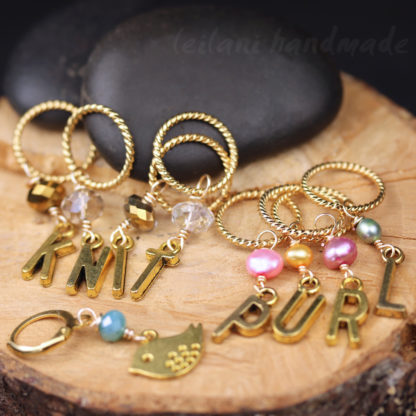 Gold Stitch markers that spell out KNIT and PURL