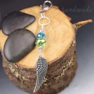 bag charm angel wing and faceted glass beads