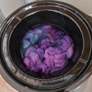 dye pot with fiber dyed purple and blue