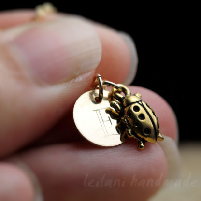 gold ladybug necklace with engraved letter charm