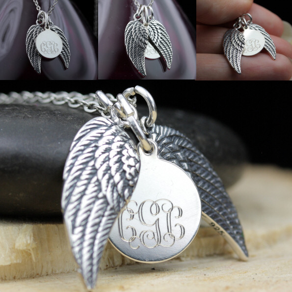 sterling silver angel wings encircling a disk with CGC engraved in monogram style